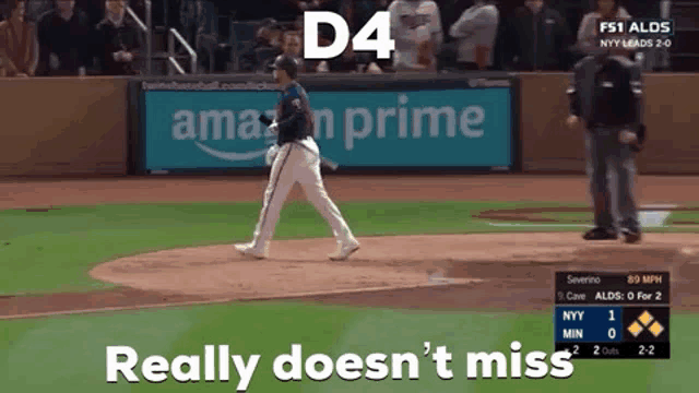 a baseball player is walking towards the pitcher 's mound with the words really does n't miss behind him .