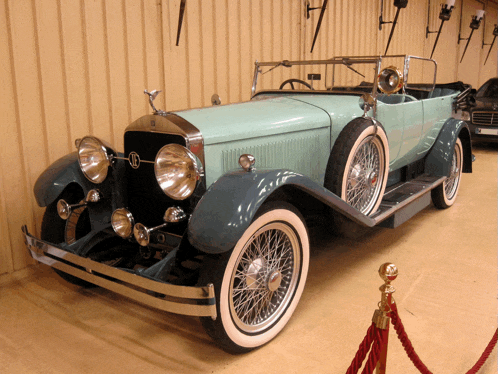 a vintage car with the letter o on the front