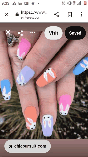 a phone screen shows a picture of a woman 's nails with bunny faces painted on them