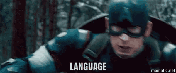 a close up of captain america 's face with the words language written below him