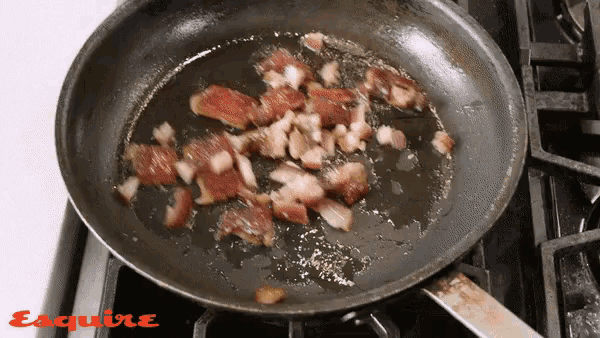 bacon is being cooked in a frying pan on a stove with esquire written on the bottom of the pan