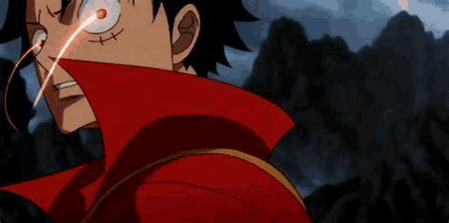 monkey d luffy from one piece is wearing a red jacket and has a red light coming out of his eyes .