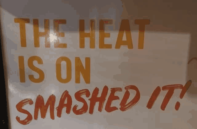 a sign that says " the heat is on smashed it " on it