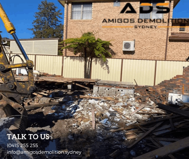 an ad for amigos demolition sydney shows a pile of rubble in front of a brick building