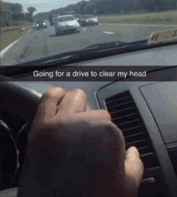 a person driving a car with the caption going for a drive to clear my head on the dashboard