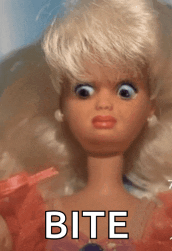 a close up of a barbie doll with the words bite written on it