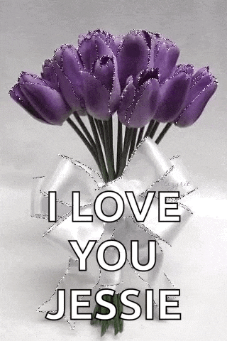 a bouquet of purple flowers in a vase with the words `` i love you jessie ''