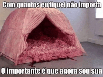 a pink tent filled with blood is sitting on the floor .