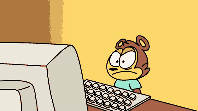 a cartoon monkey is looking at a computer monitor