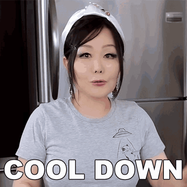 a woman wearing a headband and a gray shirt says cool down