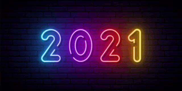 a neon sign of the year 2021 on a brick wall .