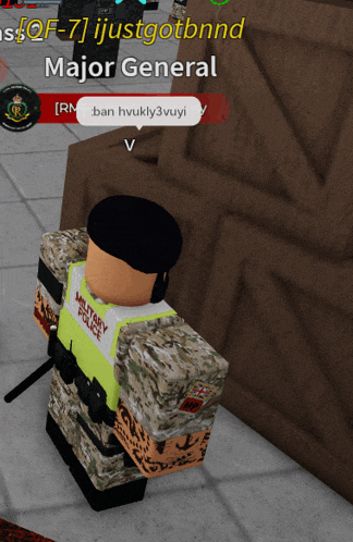 a military police officer stands in front of a wooden wall