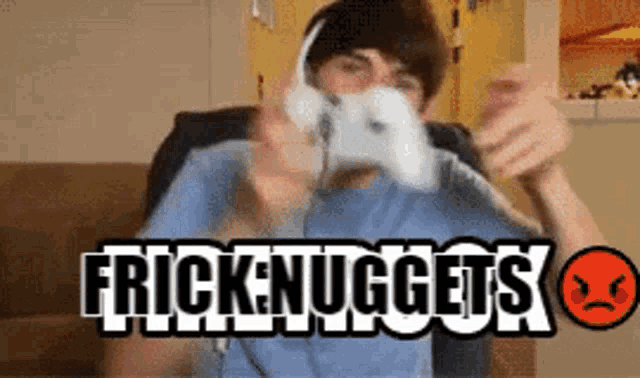 a man wearing headphones is playing a video game with the words frick nuggets written on the bottom