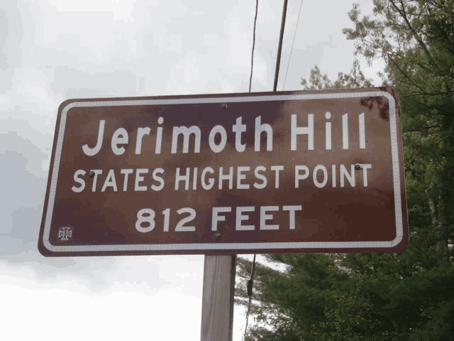 a sign that says jerimoth hill states highest point 812 feet