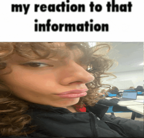 a woman with curly hair is making a funny face with the caption " my reaction to that information "