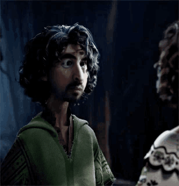 a cartoon character with curly hair and a beard is looking at a woman .