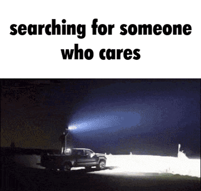 a person is searching for someone who cares with a truck in the background