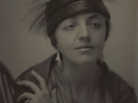 bust-length photo of a woman in a feathered hat