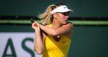 An emotional meeting of two Ukrainian-born players in the first round of Indian Wells saw Marta Kostyuk save two match points in the second-set tiebreak en route to beating Maryna Zanevska 6-7(5), 7-6(6), 7-5.