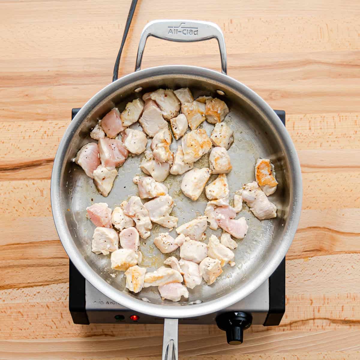 pan-searing chicken breast for chicken and chorizo pasta. 