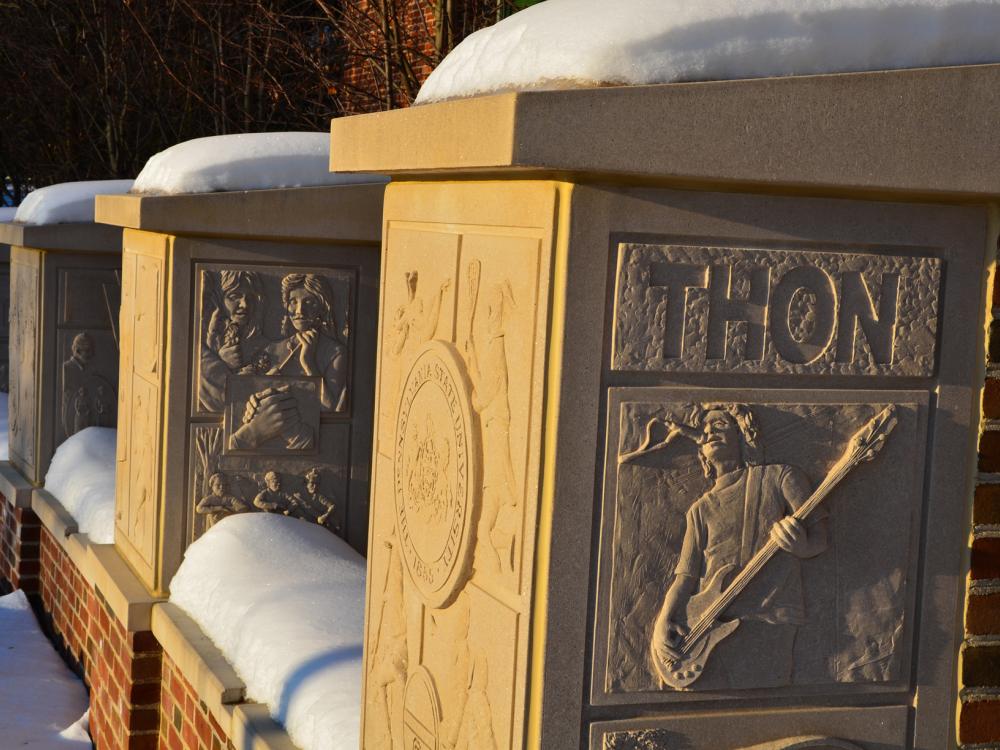 A low snow-covered wall with four pillars depicts student life at Penn State was the Senior Class Gift of 2005.