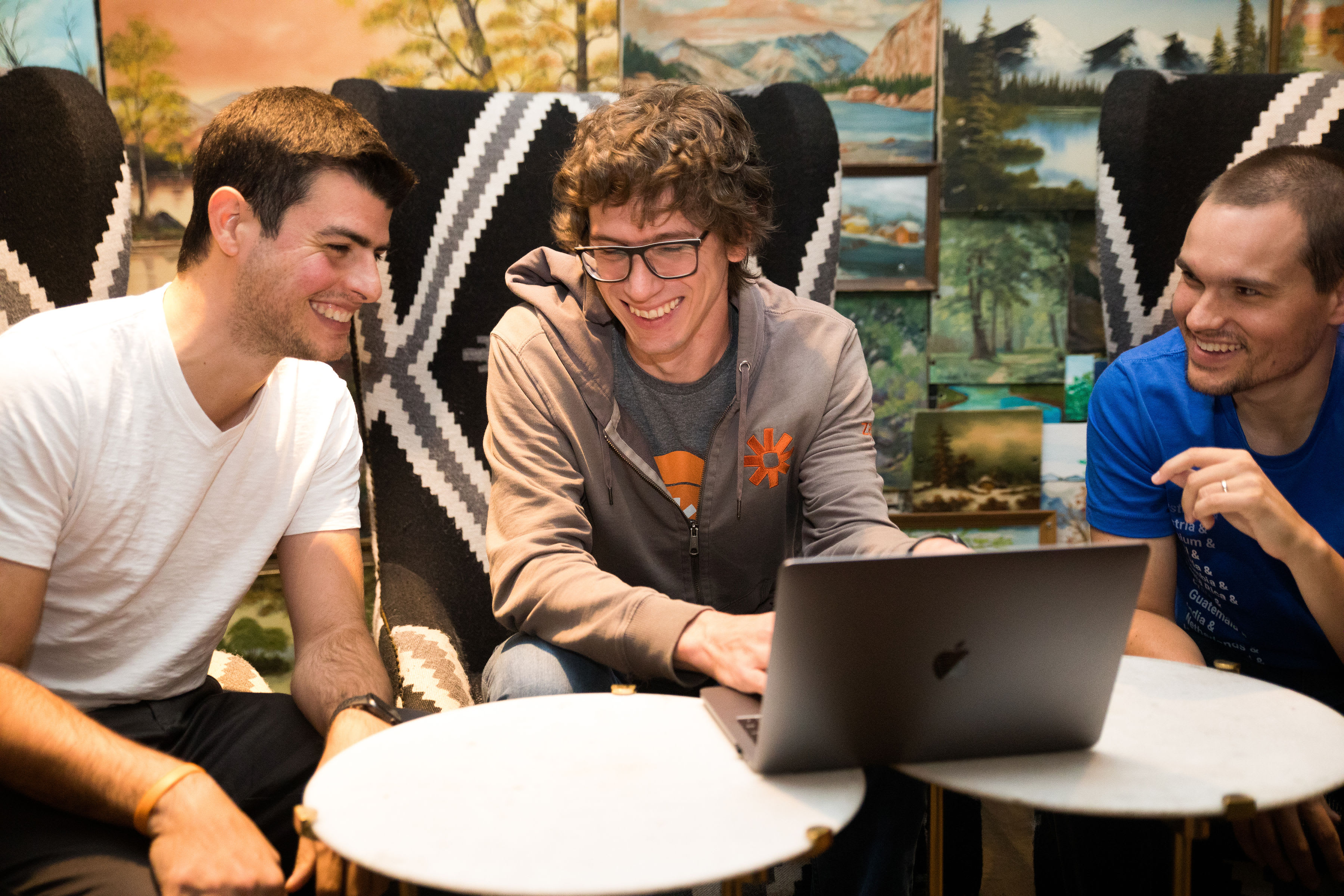 Three Zapier employees talking