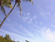 image of cirrus clouds over cumulus clouds