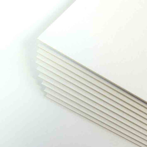 a stack of white mountboard