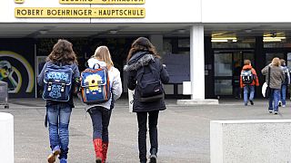 FILE - Students enter Lessing high school and Robert Boehringer elementary school in Winnenden on Monday morning, March 16, 2009.