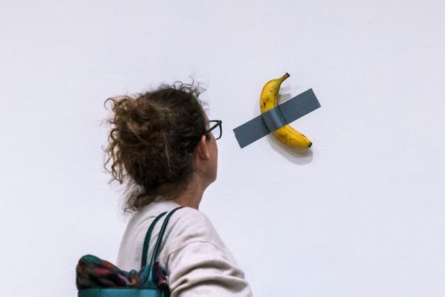 <p>Maurizio Cattelan’s piece, Comedian, a banana duct-taped to a wall, was bought by a Chinese businessman for $6.2m </p>