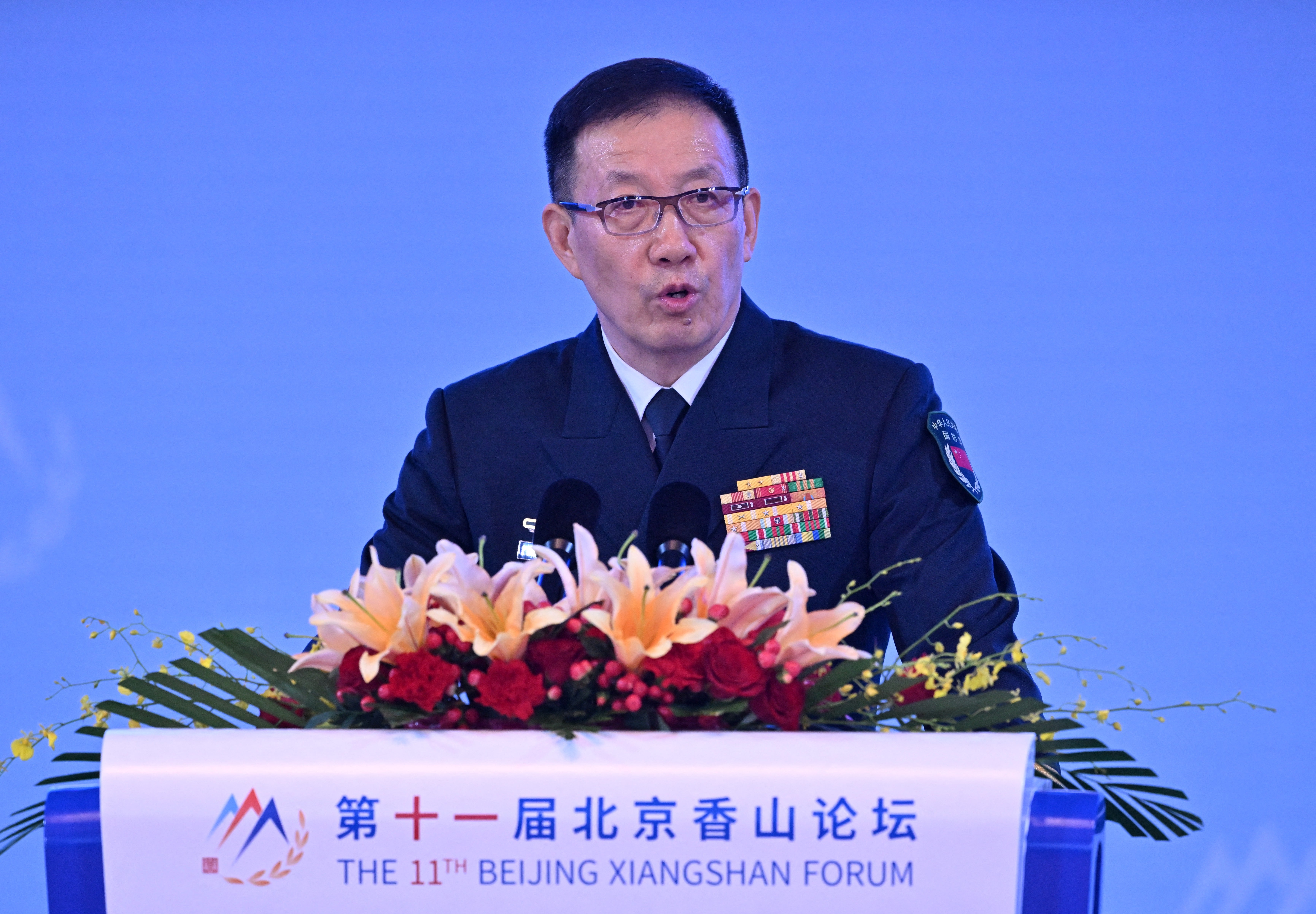 China's Defence Minister Dong Jun delivers a speech