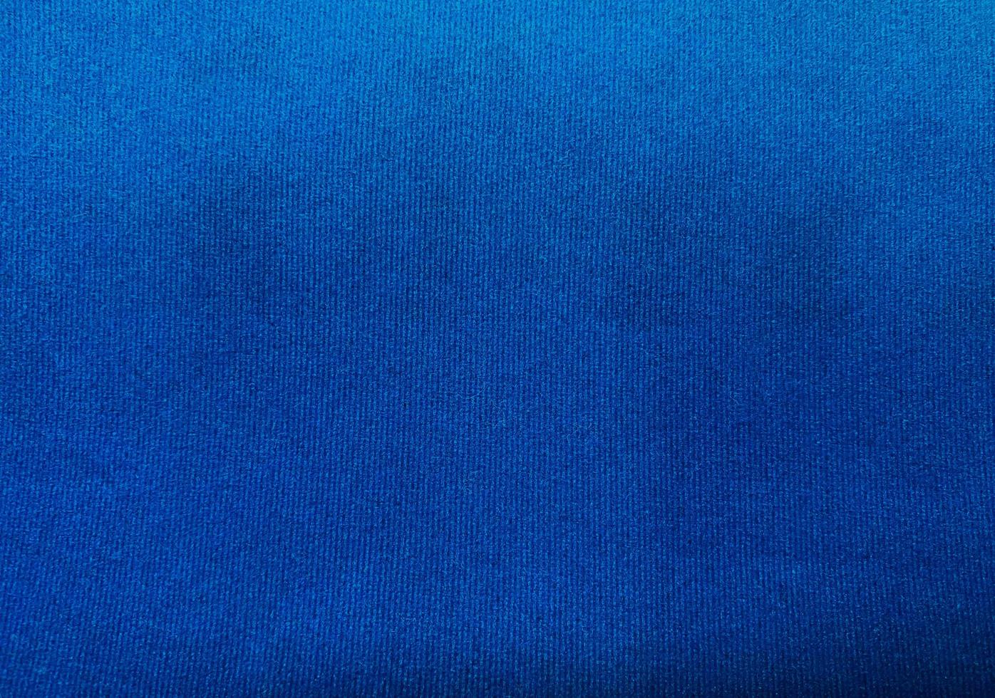 Blue velvet fabric texture used as background. Empty blue fabric background of soft and smooth textile material. There is space for text. photo