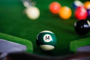 Close-up of pool ball on pool table photo