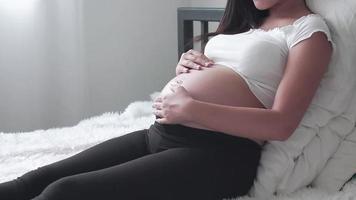 Pregnant Woman Sitting in the Bedroom. video