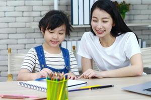 Teacher and student working on reading photo