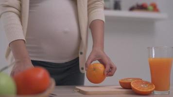 Pregnant woman with Fresh orange juice video