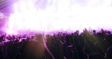 Blurry of silhouette of a concert crowd photo