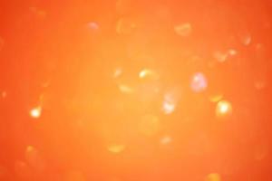 Defocus light orange sparkles glitter. Abstract background blur focus. photo