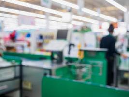 supermarket checkout cashier counter in store blurred background photo