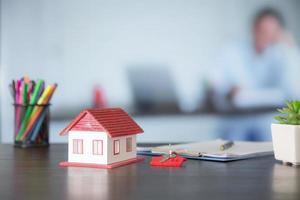 House model on wooden table in office photo