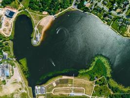 Aerial top view of blue lakes with islands and green forests in Latvia. photo