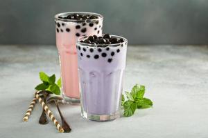 Taro and strawberry milk bubble tea in tall glasses photo