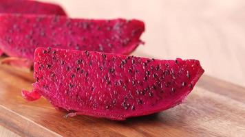 slice of dragon fruit on a chopping board. video