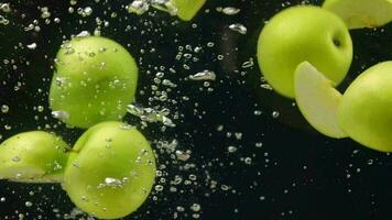 Slow motion, Apple fruit, sliced apples in water, slow motion of green apple in water video