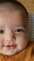 Close Up Shot of Cute Asian Pakistani 4 Months Old Baby Boy, Who is Enjoying at Home Garden at Luton City of England UK. Image Was Captured on July 23rd, 2023 video