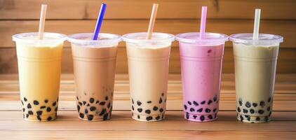 Plastic cups of different tasty bubble tea on wooden background. Generative AI photo