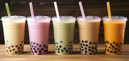 Plastic cups of different tasty bubble tea on wooden background. Generative AI photo