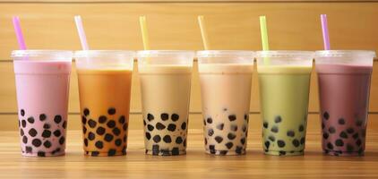 AI generated Plastic cups of different tasty bubble tea on wooden background. Generative AI photo