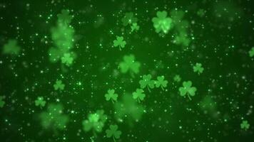 Lucky shamrocks, shiny stars and glowing glittering particles on a dark green gradient background. This Saint Patrick's Day celebration party background animation is full HD and a seamless loop. video