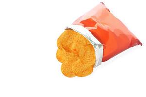 Potato chips in orange bag isolated on white background with clipping path. photo